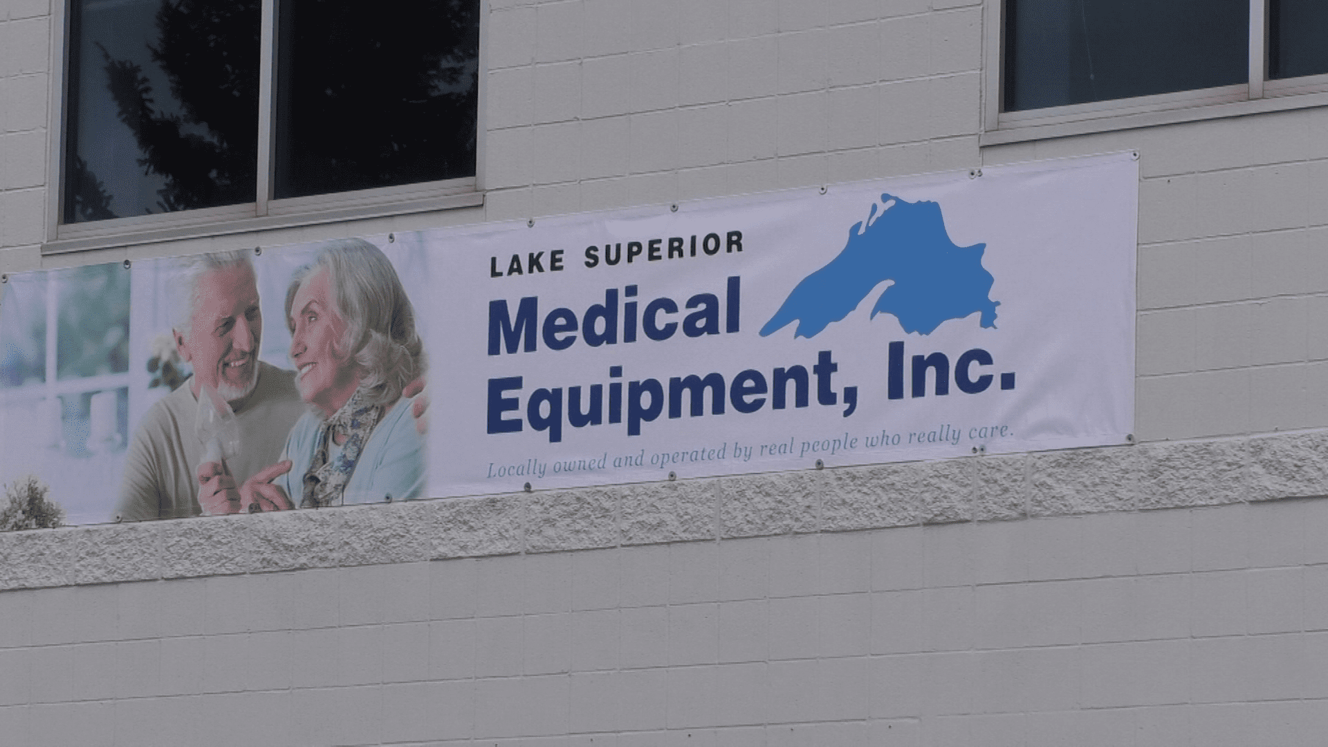 A sign of a Lake Superior Medical Equipment banner outside of the Bullyan Center