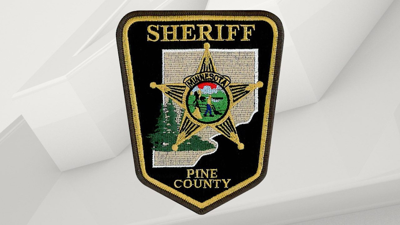 Pine County Sheriff patch over gray background.