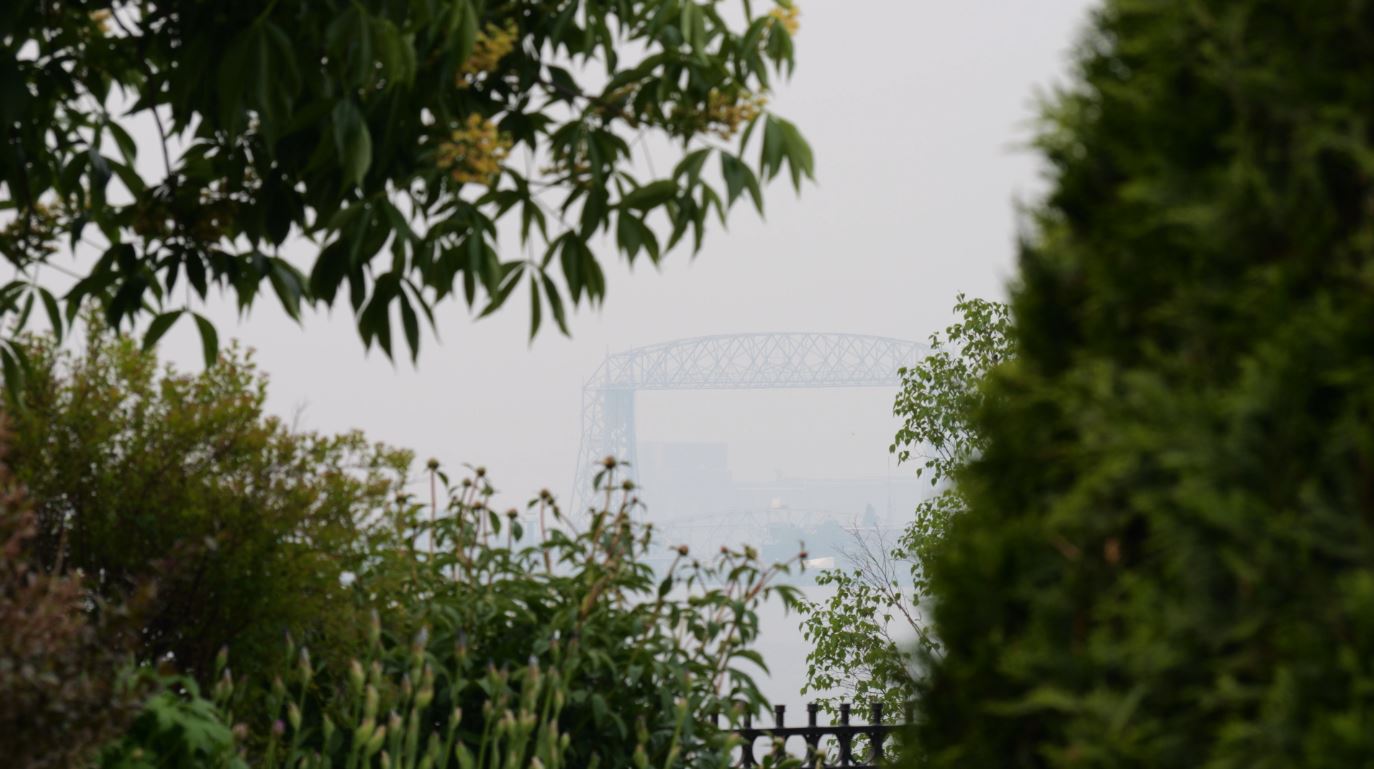 A hazy view of the Lift Bridge from the Duluth Rose Garden