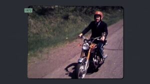 A WDIO reporter rides a motorcycle
