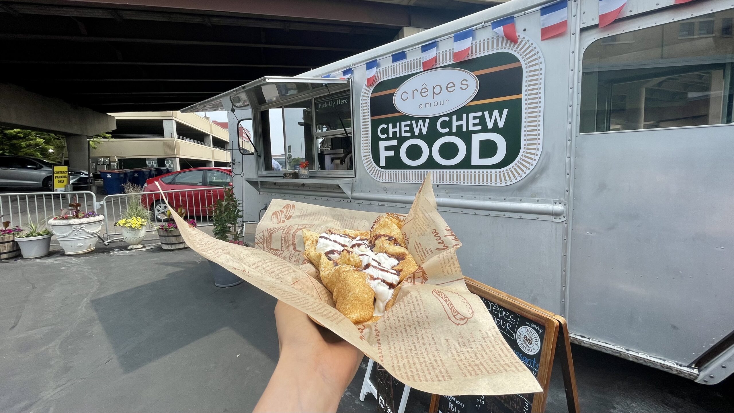 A crepe in front of the Crepes Amour food truck