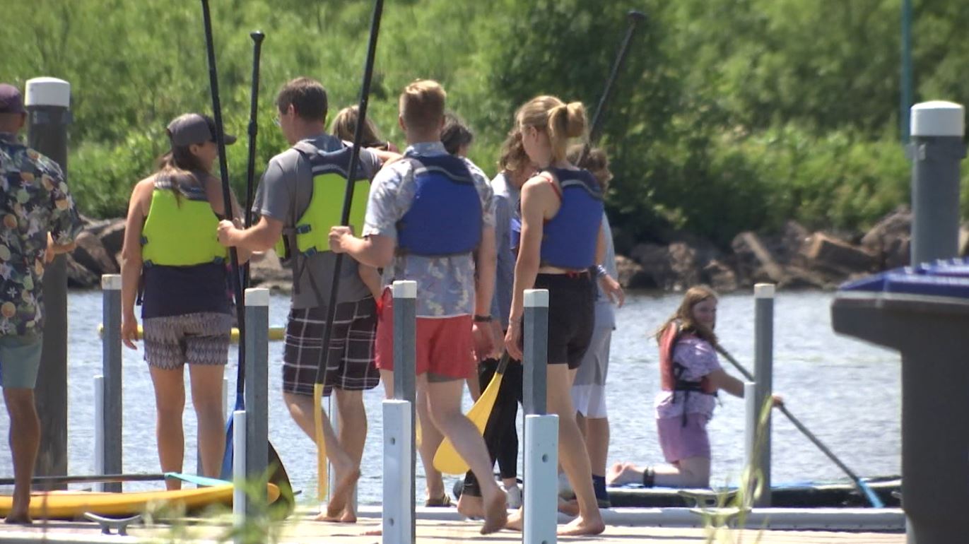 People head out to paddle board at Lake Superior Day 2022