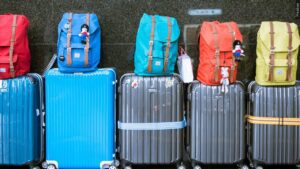 A line of luggage and backpacks