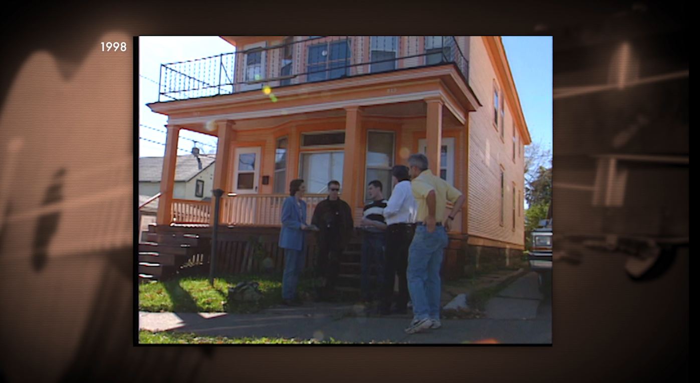 People standing outside Bob Dylan's childhood home