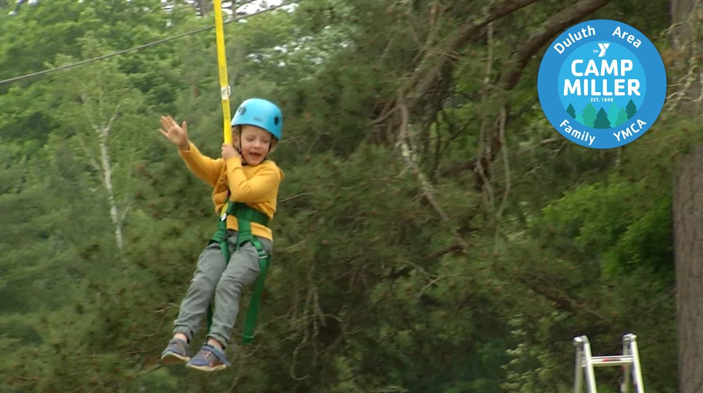 A child on the zipline at Camp Miller