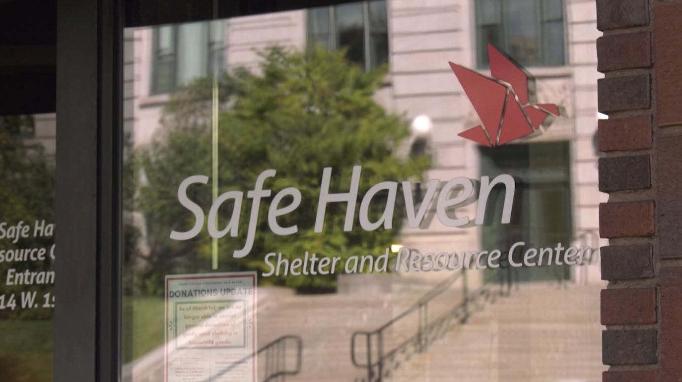 The Safe Haven logo on a door