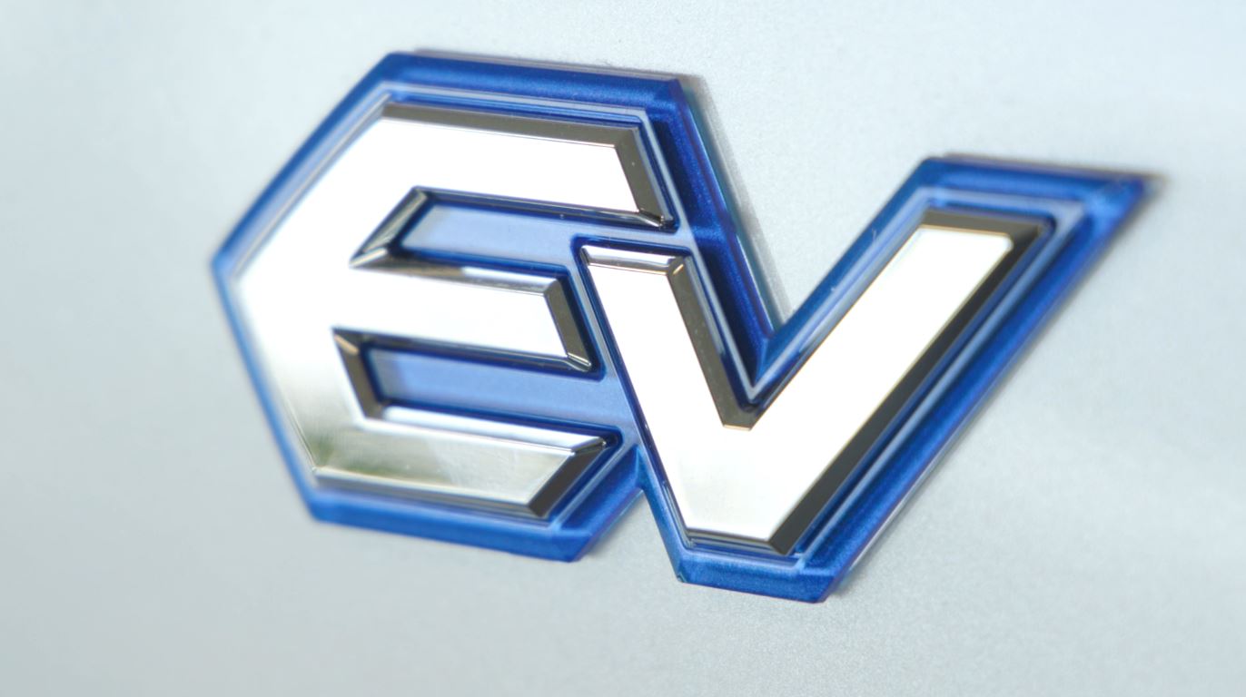 An EV logo on the side of a vehicle