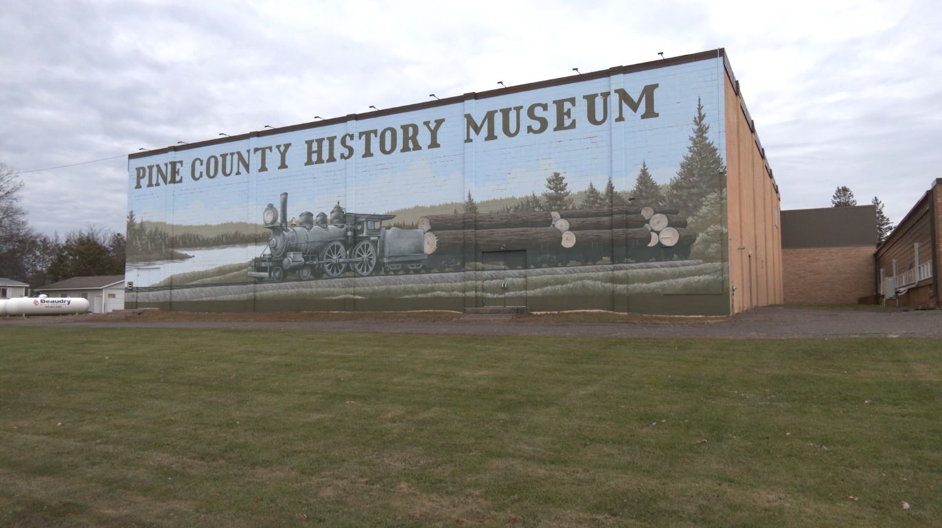 A mural on the back of the Pine County History Museum