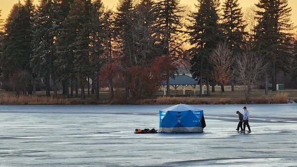 OLIP- Tammi Mathson ice fishing on a mild day