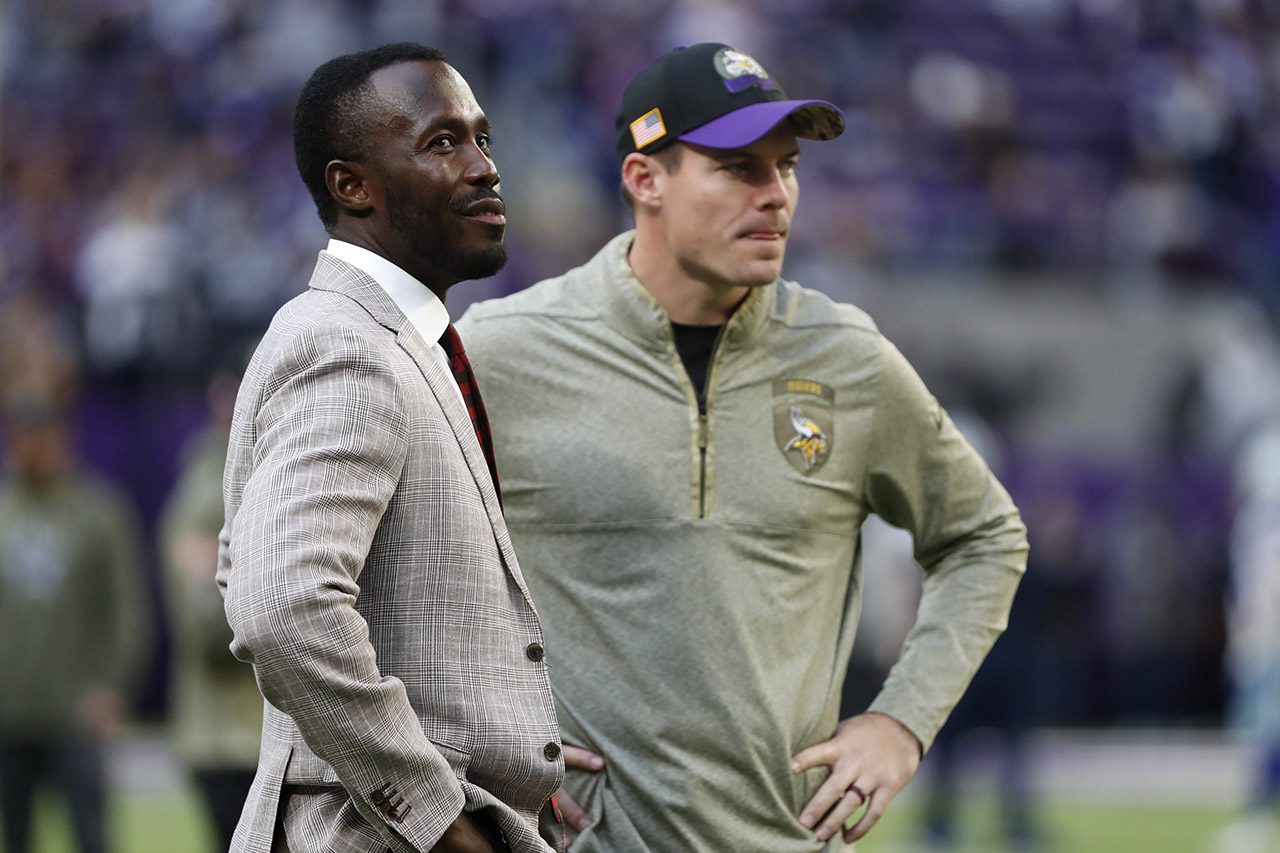 FILE - Minnesota Vikings general manager Kwesi Adofo-Mensah, left, talks with head coach Kevin O'Connell before an NFL football game against the Dallas Cowboys, Sunday, Nov. 20, 2022, in Minneapolis. The Minnesota Vikings face a crucial decision on whether or not to re-sign quarterback Kirk Cousins. They have the 11th pick in a draft that features a solid crop of quarterback prospects. (AP Photo/Bruce Kluckhohn, File)