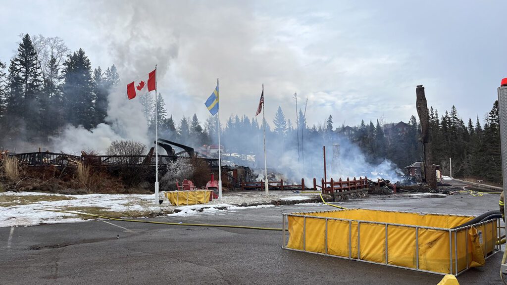 A daytime photo shows the rubble that remains of the Lutsen Lodge following a fire on Tuesday, February 6.