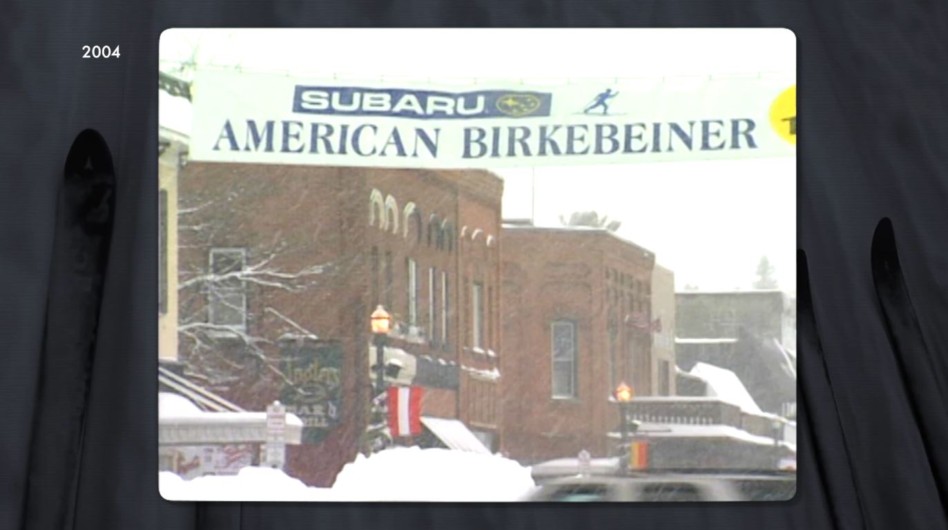 Snow falls on the 2004 American Birkebeiner banner