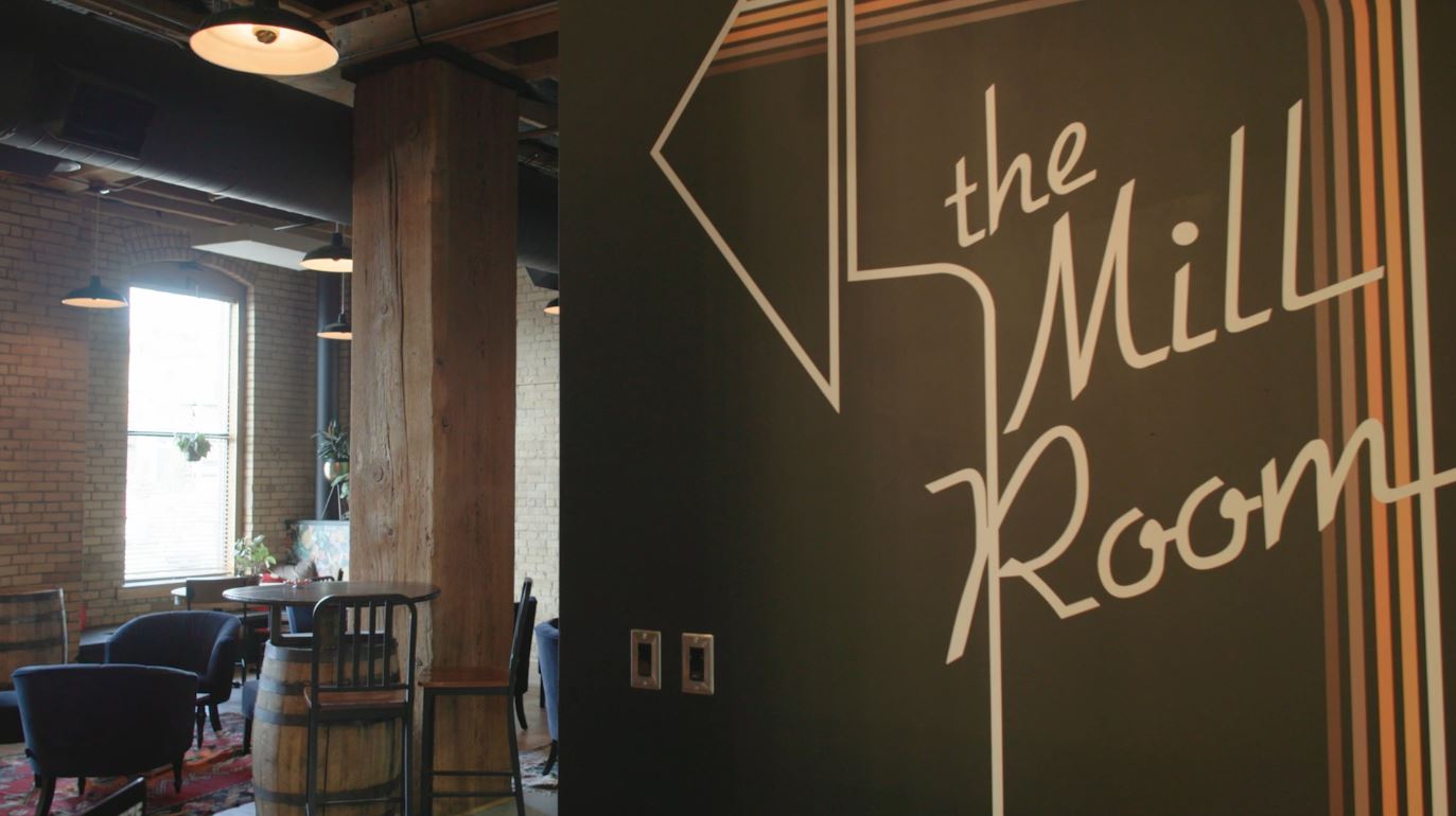 A sign pointing into the Mill Room at Hoops Brewing