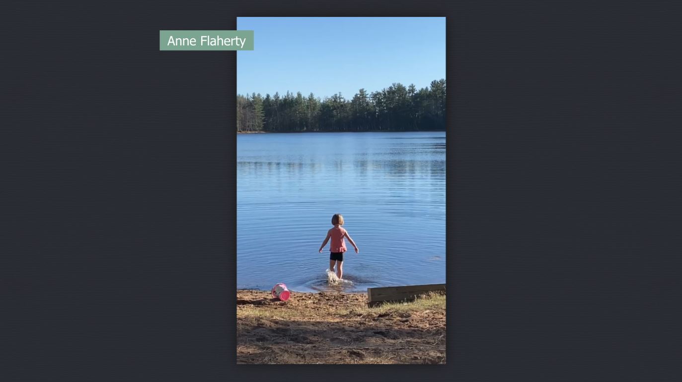 A child wading into a lake