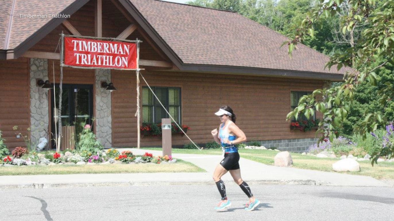 A woman runs in the Timberman Triathlon